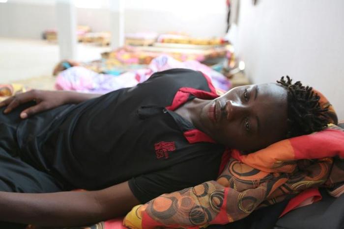 Malian migrant Souleyman Coulibaly is one of four people rescued after their boat capsized off Tunisia crossing the Mediterranean from Libya to Italy but more than 80 others are missing