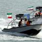 Iranian Revolutionary Guards drive speedboats at the port of Bandar Abbas in 2012 (L), and the amphibious assault ship USS Boxer is pictured during exercises in 2016