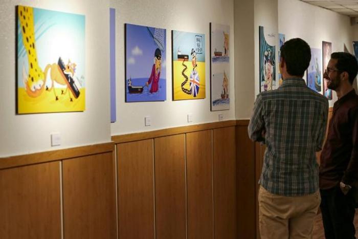 The "Pirates of the Queen" cartoon exhibition in Tehran portrays Britain's Queen Elizabeth II as a "pirate" over the seizure of an Iranian oil tanker off Gibraltar