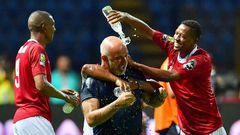 Madagascar coach Nicolas Dupuis is doused in water after an upset of African giants Nigeria