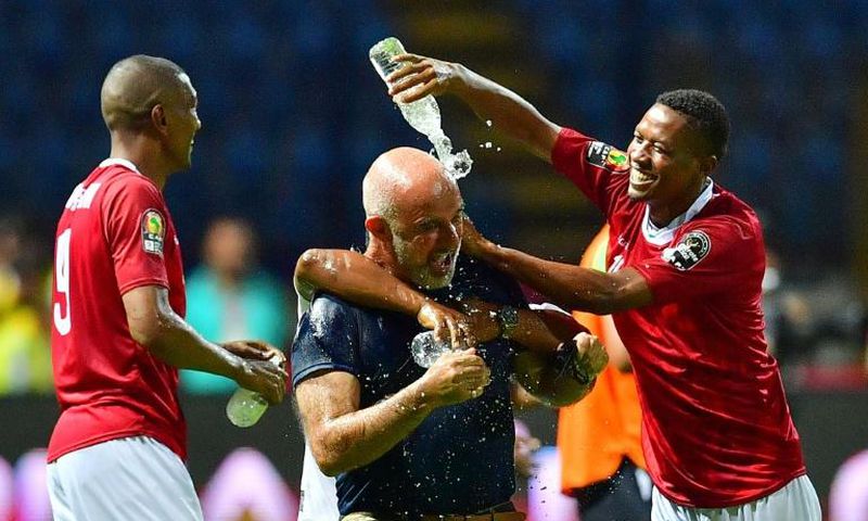 Madagascar coach Nicolas Dupuis is doused in water after an upset of African giants Nigeria