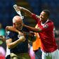 Madagascar coach Nicolas Dupuis is doused in water after an upset of African giants Nigeria