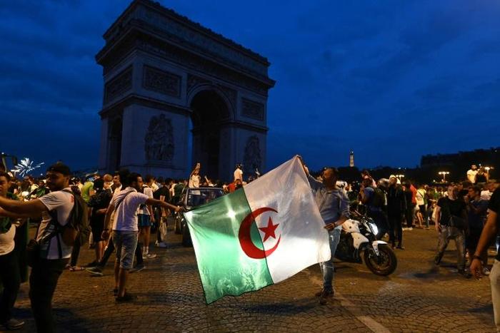 Several thousand people gathered at the Champs-Elysees in the French capital after Algeria's victory against Ivory Coast