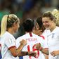 England players celebrate after Ellen White netted one of her two goals in the 2-0 win over Japan in Nice