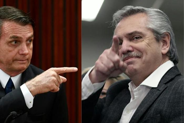 Brazilian President Jair Bolsonaro (L) expressed fears that a victory by Alberto Fernandez (R) would take Argentina on a path to economic ruin and spark an exodus