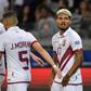 Josef Martinez (right) celebrates his goal against Bolivia that ensured Venezuela would progress to the Copa America knock-out stages