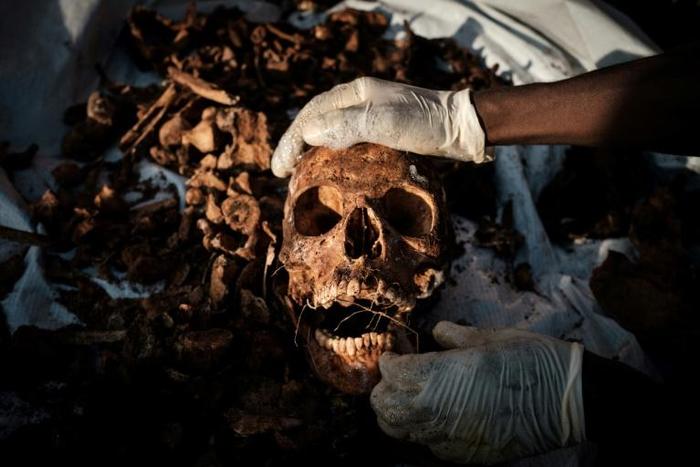 Relatives of victims of Rwanda's 1994 genocide recently recovered remains ahead of a mass burial in Gasabo, a suburb of the capital Kigali, in May 2019