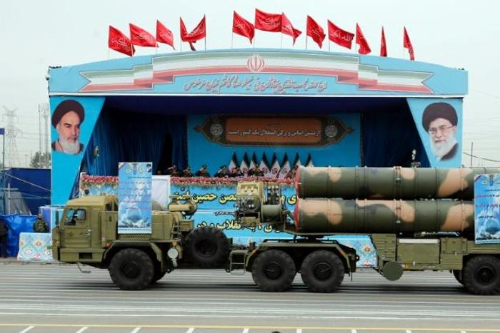 A Russian-made, S-300 missile system is driven in front of officials during a military parade earlier this year