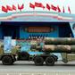 A Russian-made, S-300 missile system is driven in front of officials during a military parade earlier this year