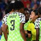 Nigeria players protest to the referee during their defeat against France after the hosts were allowed to retake the match-winning penalty