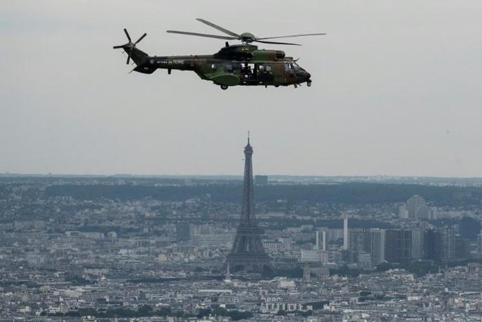 A French Eurocopter AS 532 Cougar flying during a rehearsal ahead of the Bastille day military air parade