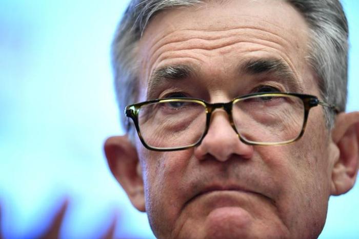 (FILES) In this file photo taken on July 10, 2019 Federal Reserve Board Chairman Jerome Powell testifies during a full committee hearing on "Monetary Policy and the State of the Economy" in Washington,DC. Risk from severe weather events is not usually ...