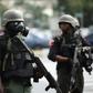 Riot police blocked roads in the capital Abuja to stop Shiite Muslim protesters