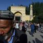 Uighur men dance after Eid al-Fitr prayers in Kashgar, in China's western Xinjiang region