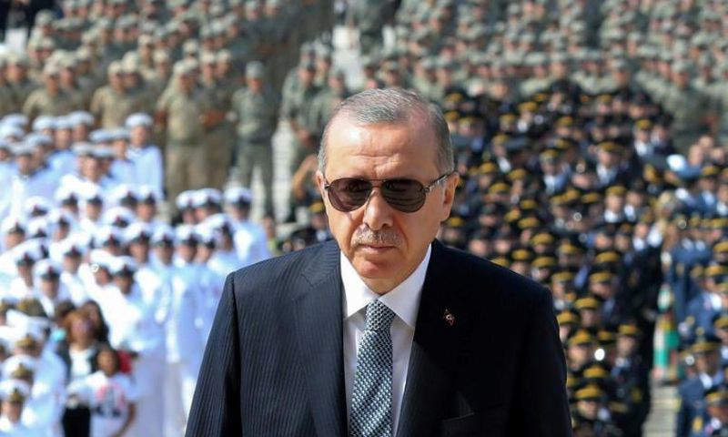 Turkish President Recep Tayyip Erdogan (C) has come under fire for undermining judicial independence