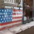 Sandbags protect a barber's shop in New Orleans as the Gulf Coast braces for the arrival of Tropical Storm Barry, expected to strengthen to a hurricane in the coming hours