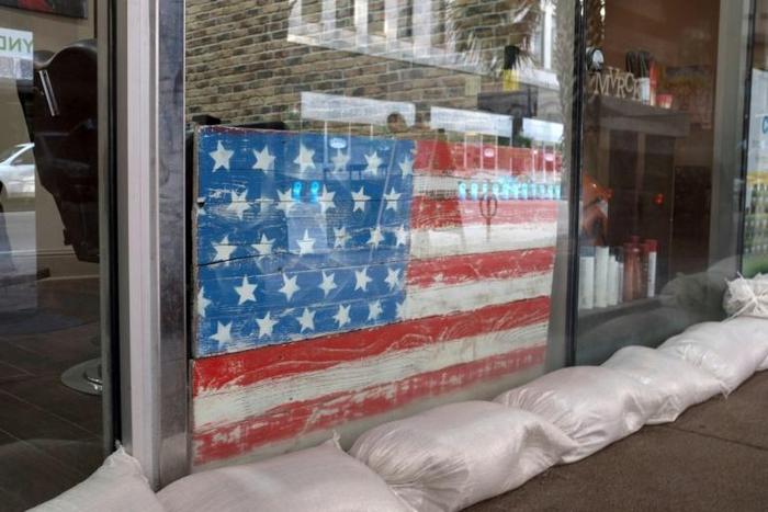 Sandbags protect a barber's shop in New Orleans as the Gulf Coast braces for the arrival of Tropical Storm Barry, expected to strengthen to a hurricane in the coming hours