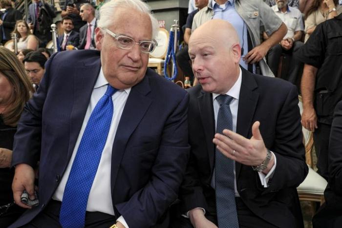 US Ambassador to Israel to David Friedman (L) speaks with White House adviser Jason Greenblatt at an event organised by an Israeli settler-linked group in mainly Palestinian east Jerusalem on June 30, 2019