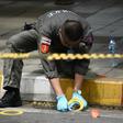 A policeman at the scene of one of the explosions
