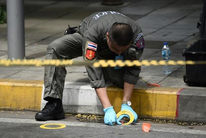 A policeman at the scene of one of the explosions