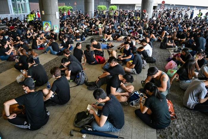 Protesters gather outside government headquarters in a fresh show of strength against the city's leader