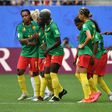 Cameroon coach Alain Djeumfa (R) said his players remained 'very professional' throughout their bad-tempered 3-0 defeat against England on Sunday