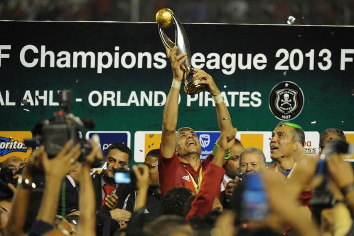 Egypt legend Wael Gomaa lifts the CAF Champions League trophy after Al Ahly won the 2013 final