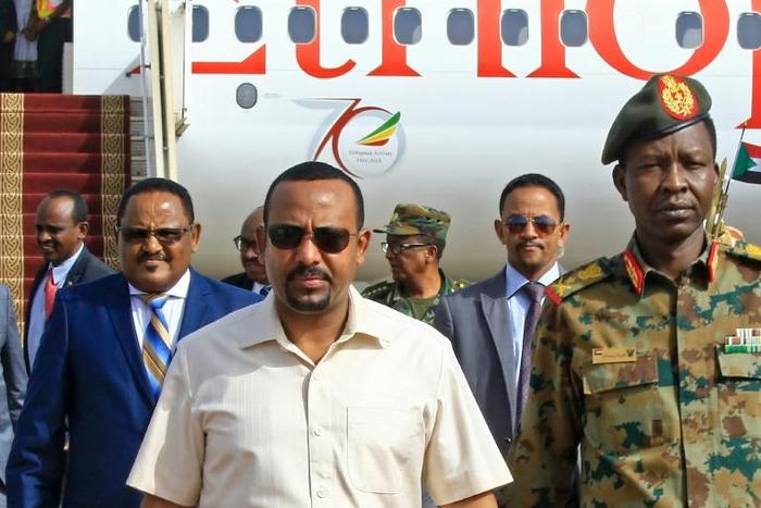 Ethiopia's Prime Minister Abiy Ahmed (C-L) has been praised for his reforms but activists fear a return to repressive tactics after the June attacks