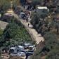 Israeli ambulance crews and security forces deploy to the scene of an explosion near the Israeli settlement of Dolev in the occupied West Bank
