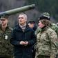 Stoltenberg (pictured centre at a military exercise) insisted that NATO did not want an 'arms race'