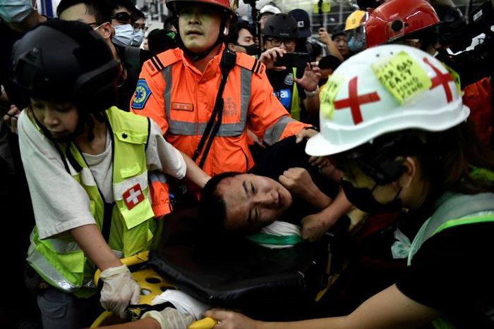 "We express the strongest condemnation of these terrorist-like actions," a Chinese official said calling the two men beaten by demonstrators "mainland China compatriots"