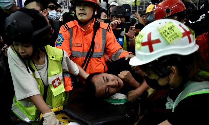 "We express the strongest condemnation of these terrorist-like actions," a Chinese official said calling the two men beaten by demonstrators "mainland China compatriots"