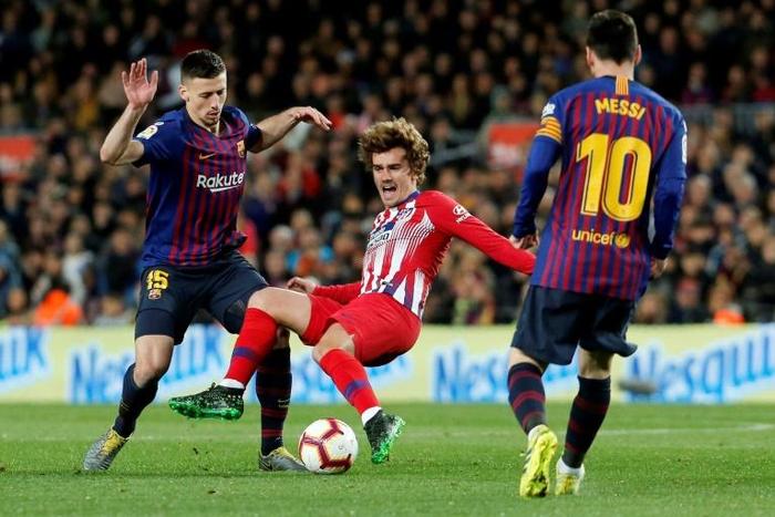(FILES) Antoine Griezmann coming up against Lionel Messi and Barcelona last season. Now the World Cup winner will hope to settle in quickly at the club he rejected a year ago
