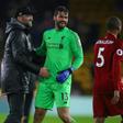 Get Becker soon: Jurgen Klopp (left) is hoping for a speedy recovery for Alisson Becker (right)