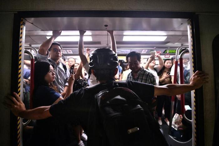 Protesters prevented the doors of subway trains closing