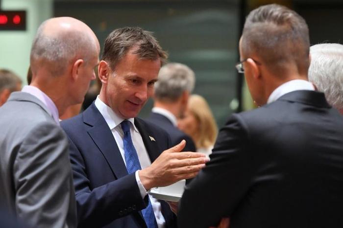 Britan's Foreign Secretary Jeremy Hunt (2nd L) talks with his counterparts Stef Blok (L) from the Netherlands and Jacek Czaputowicz (R) from Poland at a meeting in Brussels. Hunt has warned that the "small window" left to save the Iran nuclear deal was...