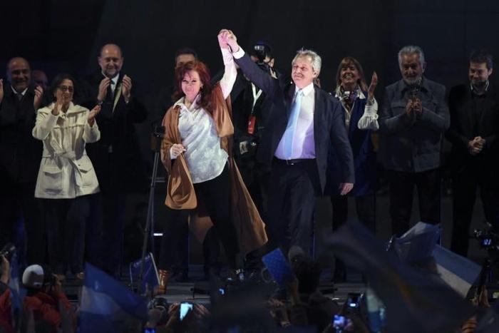 Peronist Alberto Fernandez (right) stormed to a clear victory over President Mauricio Macri in Sunday's party primaries and is now favored to win October's election