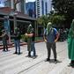 Activists block a street in Guatemala City to protest against a migration agreement signed with the US