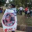 A protester in July carries a banner calling for the ousting of Malawi Electoral Commission chairwoman Jane Ansah