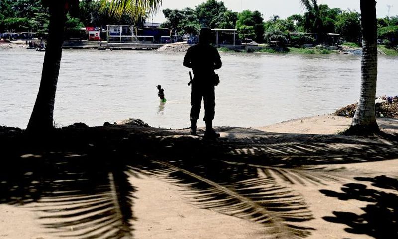 A member of the Mexican National Guard patrols the banks of the Suchiate River in Chiapas State, Mexico, in July 2019 in an effort to prevent illegal migrant crossings