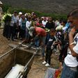 Relatives and friends of Erick Altuve attend his funeral