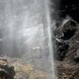 A firefighter douses a forest affected by wildfires in Gran Canaria on the Spanish Canary Islands on August 13, 2019