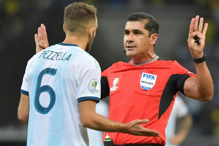 Ecuadoran referee Roddy Zambrano (right) waved away all penalty protests from Argentina players during the semi-final match against hosts Brazil