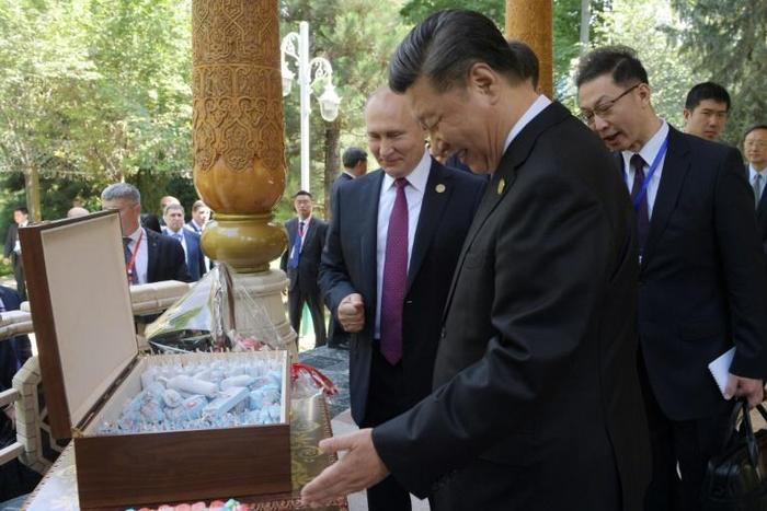 Russian President Vladimir Putin presented his Chinese counterpart Xi Jinping with ice cream for his birthday