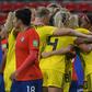 Sweden scored two late goals to beat Chile after a lengthy delay in their game due to a storm