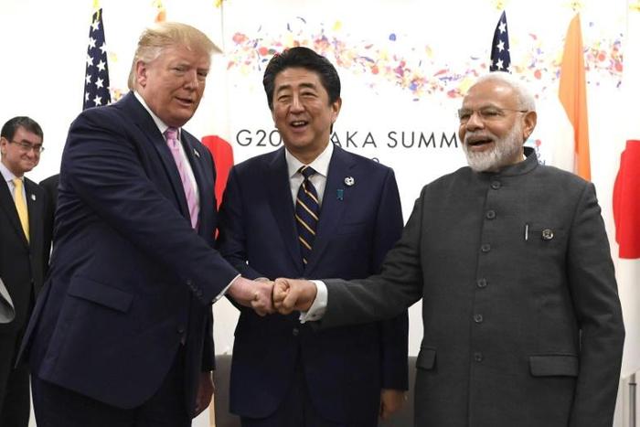 President Donald Trump opted for a jovial fist bump with Japanese Prime Minister Shinzo Abe and India's Narendra Modi