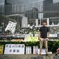 Hong Kong democracy activist Joshua Wong poses during an interview with AFP outside the government headquarters