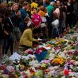 People pay their respects at a memorial site at the Botanical garden in Christchurch on March 18, 2019, three days after a shooting incident at two mosques in the city that claimed the lives of 51 Muslim worshippers