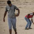 Israel has warned the Gaza Strip's residents and its Hamas rulers that further attacks on Israel could incur tougher conditions for the coastal territory; Palestinian boys carry mortar shells next to a Hamas military post August 1, 2019