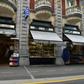 Pope Francis says he wants to see less commercialism and more piety in the Marian shrine in the French southwestern pilgrimage city of Lourdes. Visitors wait to withdraw money from a cash dispenser next to shops selling religious articles